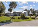 Beautifully landscaped single-Gathering home with well-maintained lawn and a metal roof at 2012 River Basin Ter, Punta Gorda, FL 33982