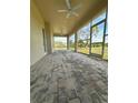 Spacious screened lanai with a brick floor, offering serene views of the outdoors at 6219 Sweden Blvd, Punta Gorda, FL 33982
