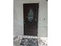 Elegant front door with decorative glass, enhancing the curb appeal of this charming single-Gathering home at 710 Aqui Esta Dr, Punta Gorda, FL 33950