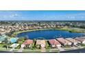 An aerial view showcases the single-Gathering home's lakefront location and desirable neighborhood at 7346 Talon Bay Dr, North Port, FL 34287