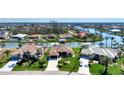 Aerial view showcasing a beautiful waterfront community at 15706 Viscount Cir, Port Charlotte, FL 33981