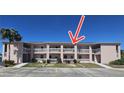 Front view of condo building showcasing its architecture at 179 Boundary Blvd # 7, Rotonda West, FL 33947