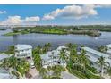 Luxury waterfront home with private dock, lush landscaping, and stunning water views at 13310 Anglers Way, Placida, FL 33946