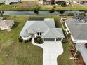 Single-story home with pool and canal views at 256 Mariner Ln, Rotonda West, FL 33947