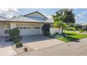 Charming single-story home with well-manicured landscaping and a two-car garage at 101 Pebble Rock Dr, Venice, FL 34293