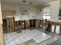 Renovation in progress, new kitchen with white tile floor at 105 Crestview Dr, Englewood, FL 34223