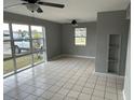 Spacious living room with tile floors and large windows at 21242 Glendale Ave, Port Charlotte, FL 33952