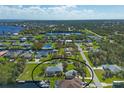 Wide aerial view of home and surrounding neighborhood at 5105 Ackley Ter, Port Charlotte, FL 33981