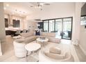 Spacious living room with open floor plan and modern furniture at 2213 Oleada Ct, Englewood, FL 34224