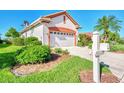 Side view of house showing garage and mailbox at 3238 Osprey Ln, Port Charlotte, FL 33953