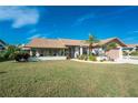 Well-maintained house with a neatly manicured lawn at 5826 Harrison Rd, Venice, FL 34293