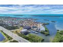 Aerial view of waterfront community with marina, boat slips, and resort-style amenities at 1954 Oregon Trl # 2G, Englewood, FL 34224