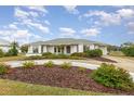 Single story home with a landscaped yard and circular driveway at 4106 Library St, Port Charlotte, FL 33948