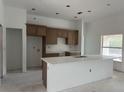 Bright kitchen with an expansive island and stylish cabinetry at 7351 Lighthouse St, Englewood, FL 34224