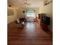 Spacious living room featuring laminate floors and ample natural light at 7472 Stetson Ln, Port Charlotte, FL 33981