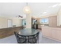 Kitchen features stainless steel appliances and an adjacent breakfast nook at 537 Shamrock Blvd, Venice, FL 34293