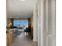 Bright entryway with view of living room and marina at 5850 Gasparilla Rd # M7, Boca Grande, FL 33921