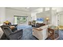 Bright living room with comfortable seating and access to a patio at 7297 Jennifer Dr, Port Charlotte, FL 33981