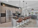 Modern kitchen with stainless steel appliances and an island at 14252 Joggins Ave, Port Charlotte, FL 33981