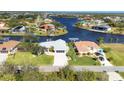 Aerial view of canal-front home with private dock at 15546 Viscount Cir, Port Charlotte, FL 33981