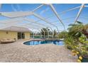 Inviting pool area with a pergola and plenty of space for relaxation at 233 Marker Rd, Rotonda West, FL 33947