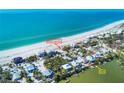 Aerial view of waterfront home with private dock and beach access at 534 Gulf Blvd, Placida, FL 33946