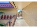 Interior hallway with view of tropical landscape at 66 Boundary Blvd # 271, Rotonda West, FL 33947