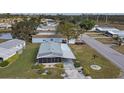 Aerial view of a single-story home with a screened porch and landscaped yard at 735 Summersea Ct, Englewood, FL 34223