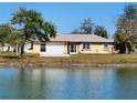 Single-story house with a view of a lake at 13278 Carter Ave, Port Charlotte, FL 33981