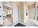 Front entry with white door leading to living room at 13478 Carrie Ave, Port Charlotte, FL 33953