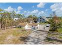 Aerial view showing a house and separate structure needing renovation at 1665 Manor Rd, Englewood, FL 34223