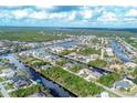 Aerial view of waterfront community with houses and canals at 17164 Canary Ln, Port Charlotte, FL 33948