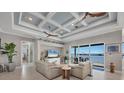 Spacious living area with water views and coffered ceiling at 1900 Illinois Ave, Englewood, FL 34224