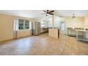 Kitchen features stainless steel appliances and tile flooring at 272 Cedar St, Englewood, FL 34223