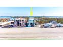 Aerial view of beachfront property, showcasing its location and proximity to the ocean at 50 Meredith Dr # 12, Englewood, FL 34223