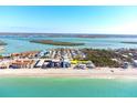 Beachfront property aerial view, highlighting its coastal setting and surrounding neighborhood at 50 Meredith Dr # 12, Englewood, FL 34223