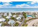 Beachfront property view with tennis courts and ocean access at 5000 Gasparilla Rd # 48, Boca Grande, FL 33921