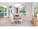 Bright dining room with a round table and four chairs at 70 Marker Rd, Rotonda West, FL 33947