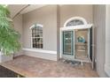 Inviting entryway with double doors and a decorative mat at 70 Marker Rd, Rotonda West, FL 33947