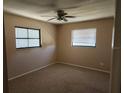 Spacious bedroom with carpet flooring and window at 7330 Regina Dr, Englewood, FL 34224