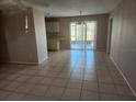 Bright living room with tile floors and access to the kitchen at 7330 Regina Dr, Englewood, FL 34224