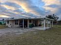 View of home's side and carport at 839 E 4Th St, Englewood, FL 34223