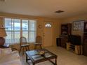 Living room with seating and large window at 839 E 4Th St, Englewood, FL 34223