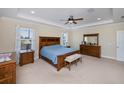 Spacious main bedroom with a king-size bed, and plenty of natural light at 8626 Agate St, Port Charlotte, FL 33981