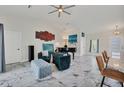 Open living space with marble floors and stylish furnishings at 11247 Euler Ave, Englewood, FL 34224