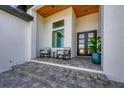 Covered porch with rocking chairs, offering a relaxing outdoor space at 1169 Boundary Blvd, Rotonda West, FL 33947