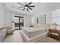 Bright bedroom with large windows and access to a pool view at 1169 Boundary Blvd, Rotonda West, FL 33947