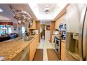 Kitchen boasts granite countertops and stainless steel appliances at 145 Bunker Rd, Rotonda West, FL 33947