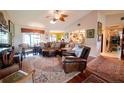 Spacious living room featuring leather furniture and hardwood floors at 145 Bunker Rd, Rotonda West, FL 33947