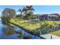 Backyard oasis with canal views and a dock at 197 Bunker Rd, Rotonda West, FL 33947